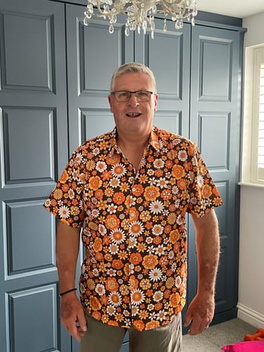 Customer photo review of Men's Floral Vintage Flower Button Up 70s Themed Disco Party Short Sleeve Beach Summer Shirt
