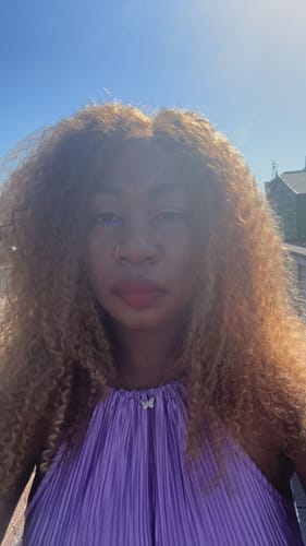 Customer photo review of CurlyMe Wear Go Glueless Highlights Ombre Hair Pre-cut HD Lace Kinky Curly Wig