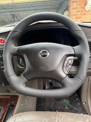 Customer photo review of Sports Black Leather With Perforated Sides Steering Wheel Core for Nissan Y61 GU Patrol