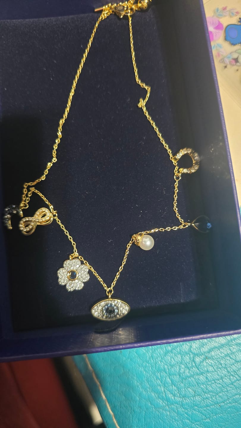 Customer photo review of COLLAR GARGANTILLA SWAROVSKI SIMBOLICA LUNA INFINITO TREBOL OJO HERRADURA ORO