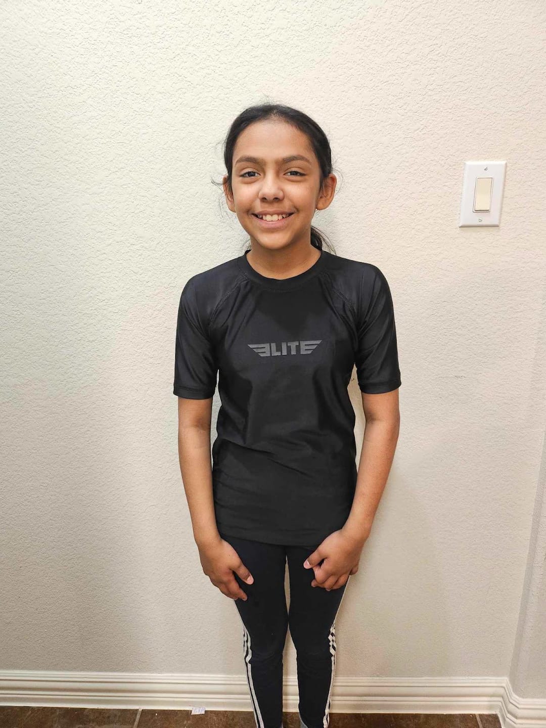 Customer photo review of Standard Black Short Sleeve No-Gi Kids BJJ Rash Guard