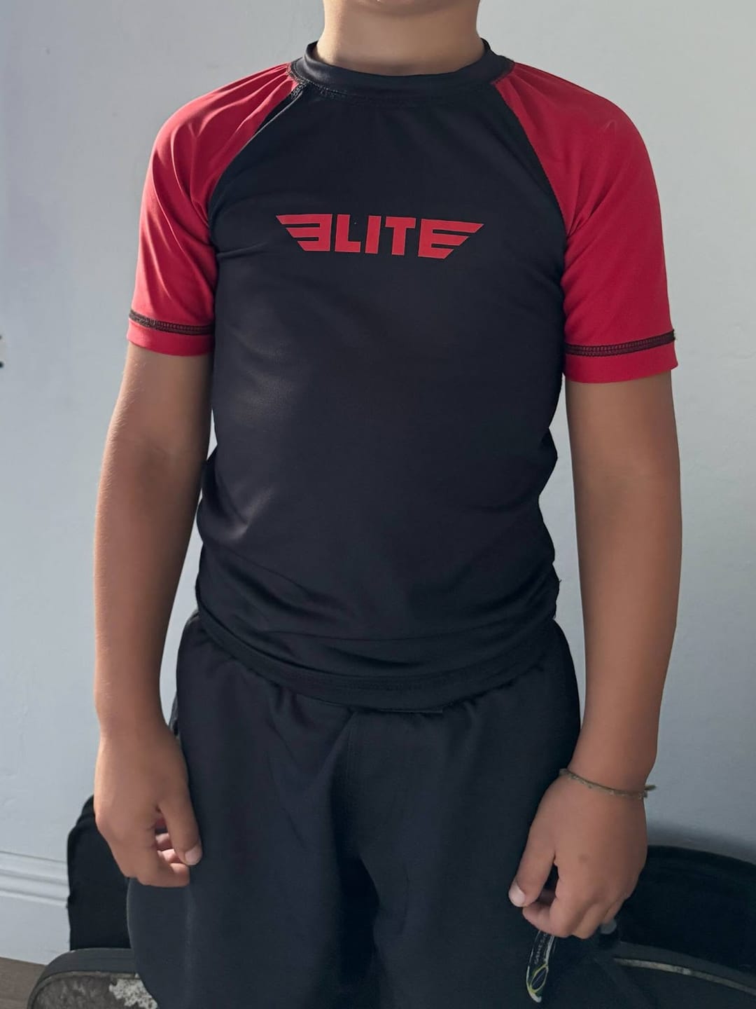 Customer photo review of Standard Red Short Sleeve No-Gi Kids BJJ Rash Guard