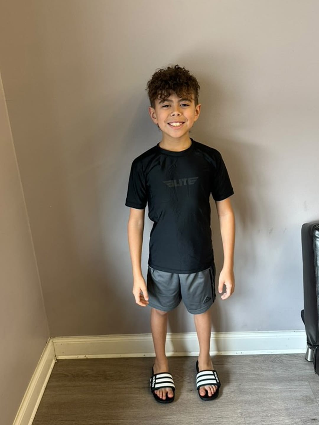 Customer photo review of Standard Black Short Sleeve No-Gi Kids BJJ Rash Guard