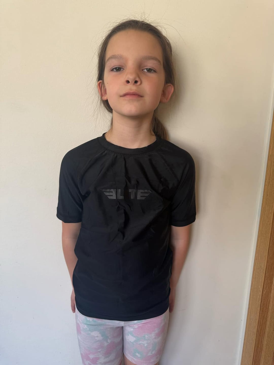 Customer photo review of Standard Black Short Sleeve No-Gi Kids BJJ Rash Guard