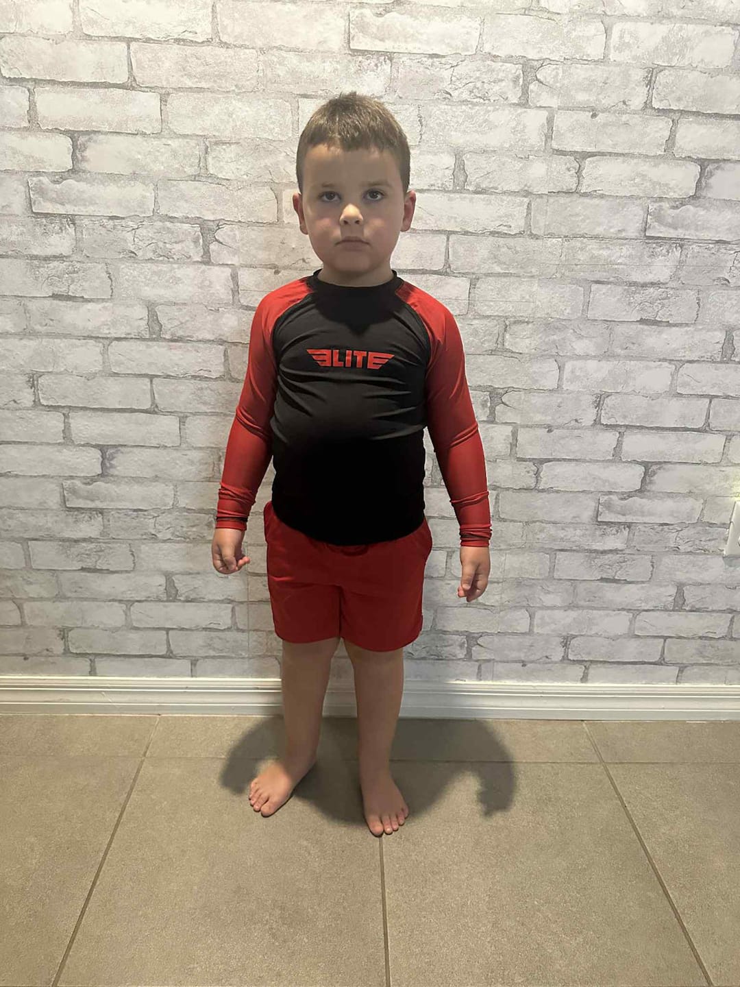 Customer photo review of Standard Red Long Sleeve No-Gi Kids BJJ Rash Guard