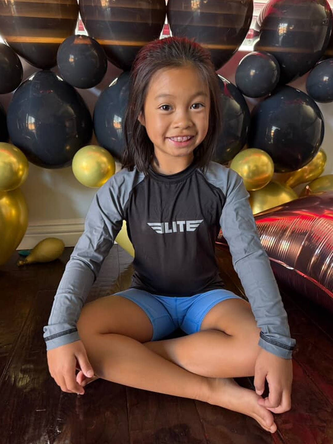 Customer photo review of Standard Gray Long Sleeve No-Gi Kids BJJ Rash Guard