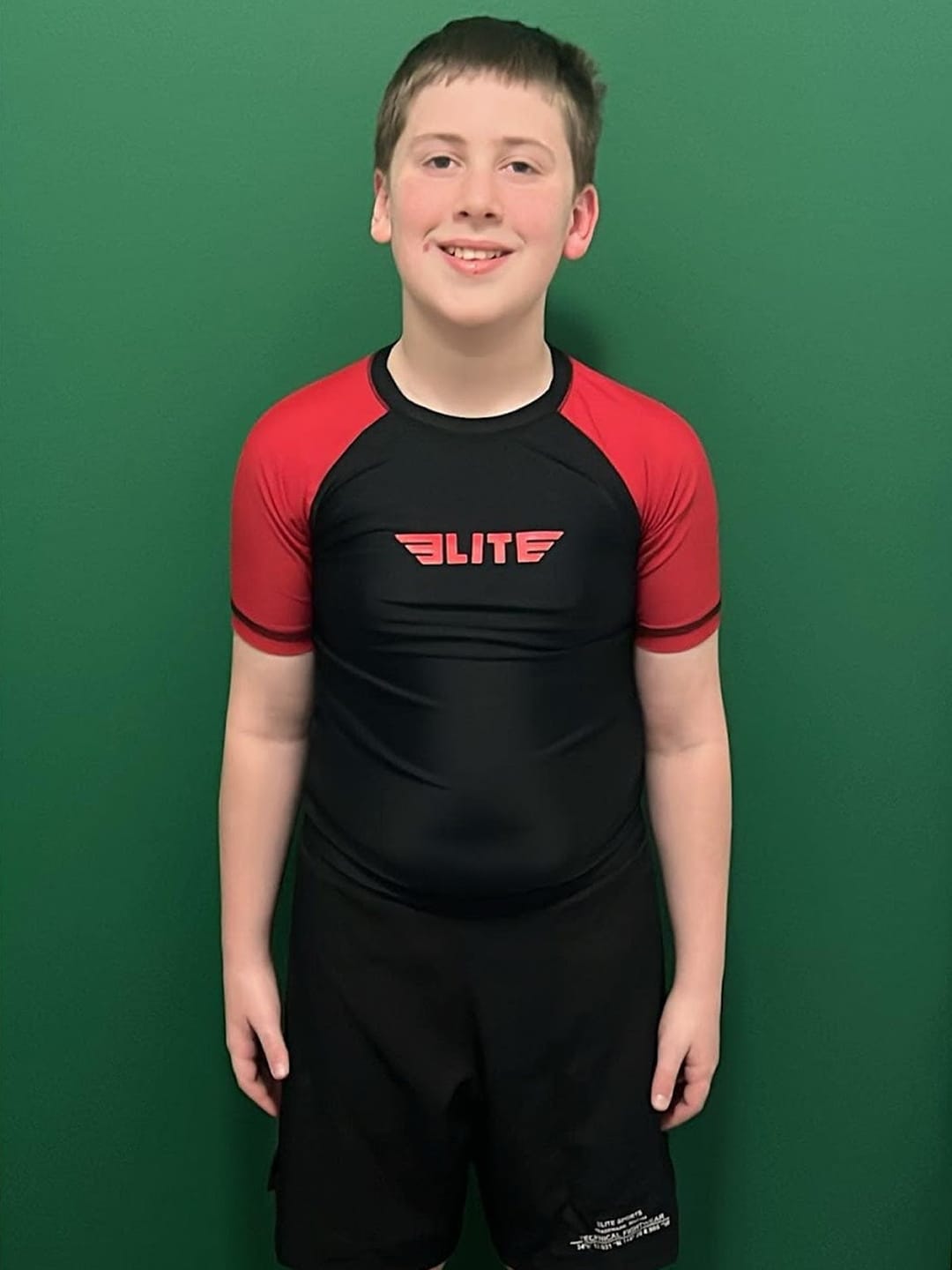 Customer photo review of Standard Red Short Sleeve No-Gi Kids BJJ Rash Guard