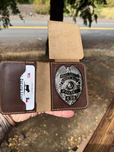 Simon R.'s badge wallet, badge inserted