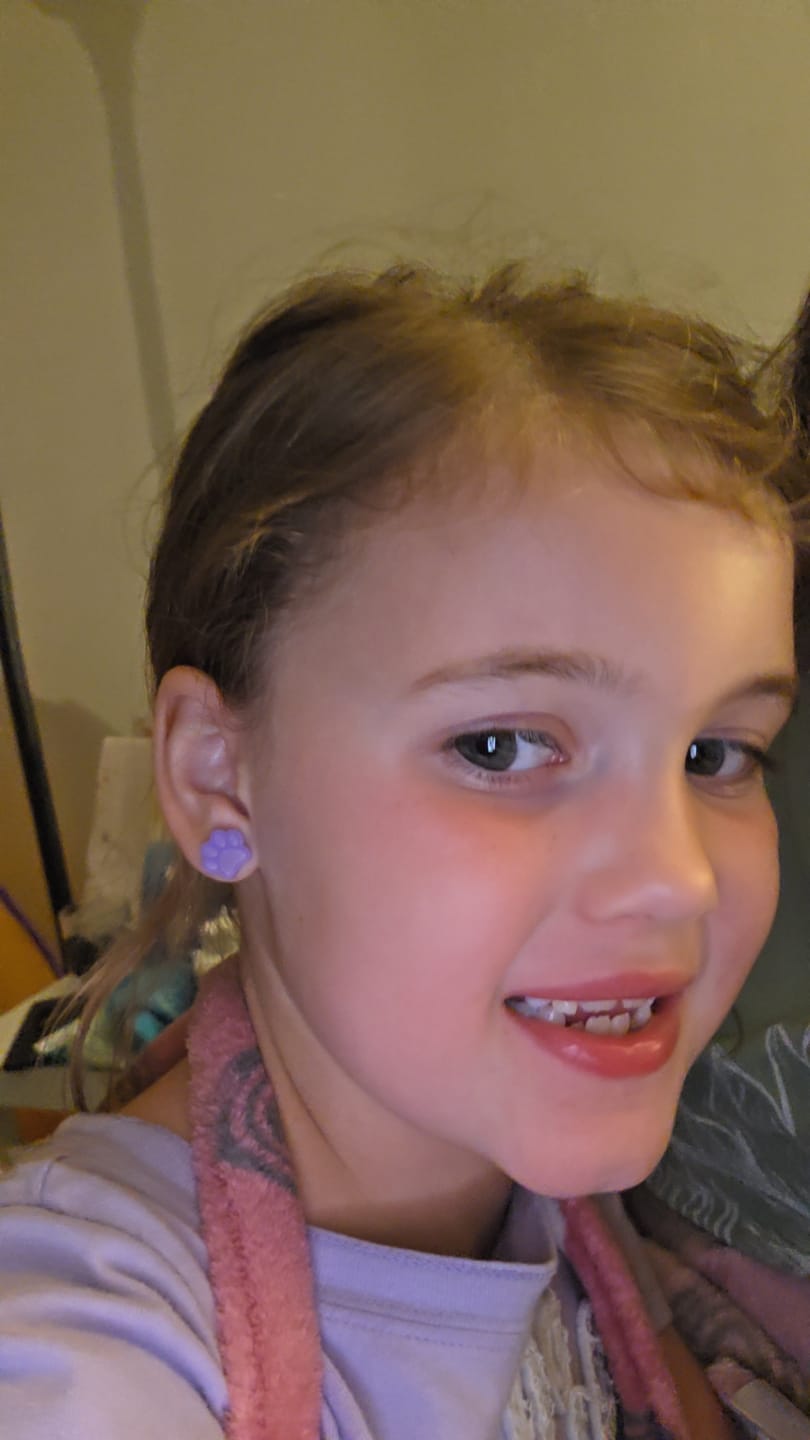 Customer photo review of Paw Print Studs Hypoallergenic Earrings for Sensitive Ears Made with Plastic Posts