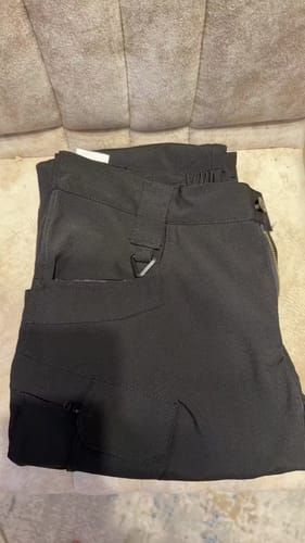 Dark cargo trousers laid out