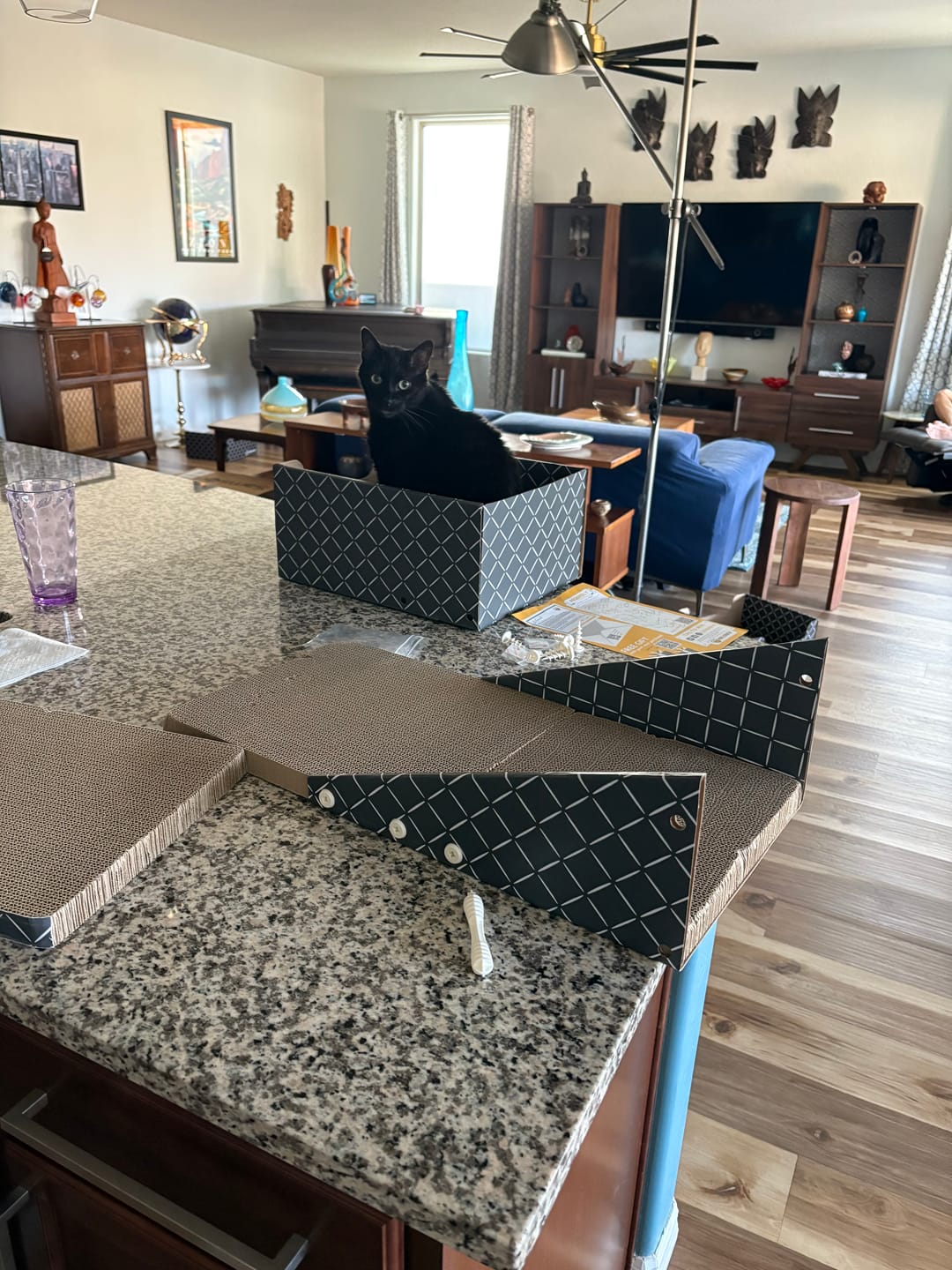 Customer photo review of 26" L Shaped Cat Scratcher Box and Cat Bed with Double-Sided Cardboard Cat Scratch Pad