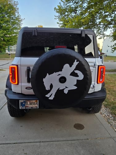 Customer photo review of Bigfoot Sasquatch Riding a Bronco Spare Tire Cover Design