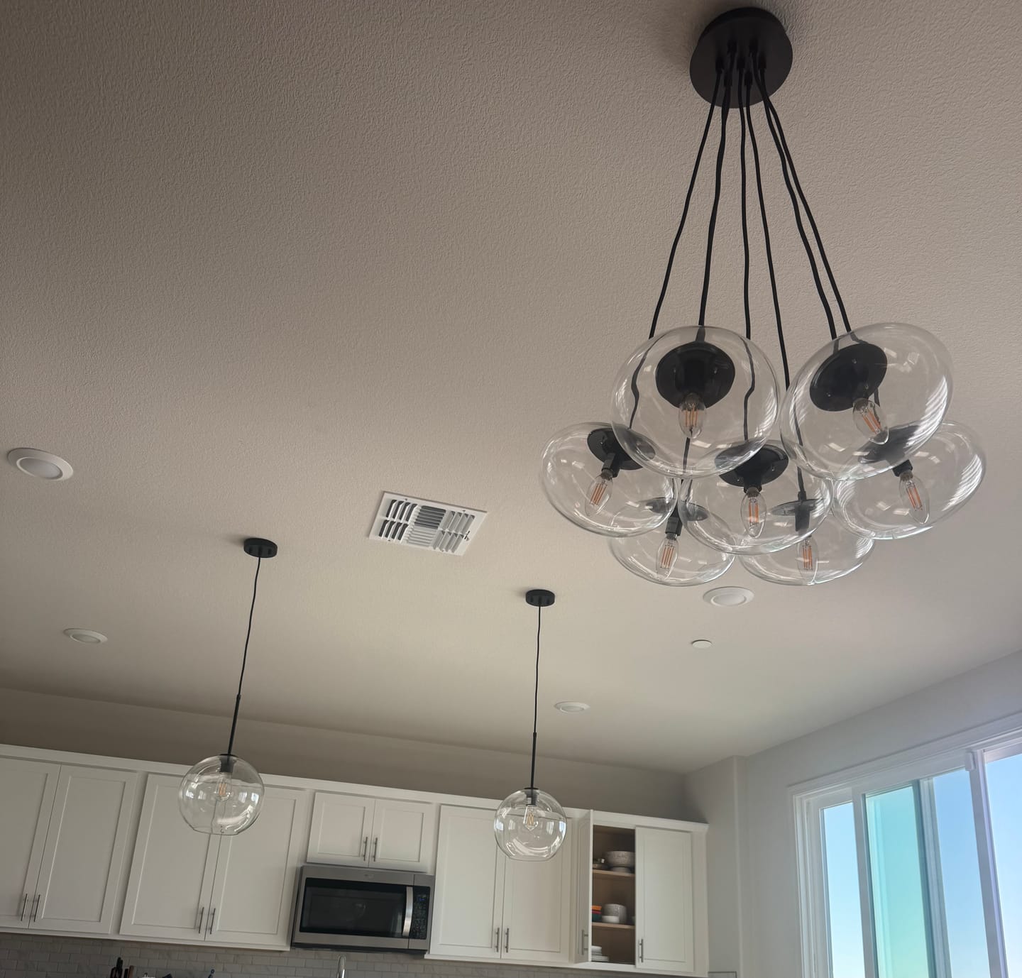 Customer photo review of Single-Light Sculptural Glass Globe Pendant
