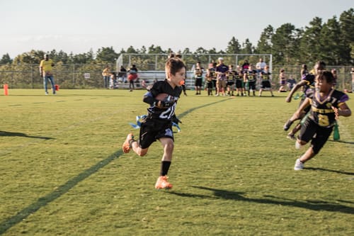 Customer photo review of The Flintstones "Bedrock Blitz" Football Cleats - Quantum Speed by Phenom Elite