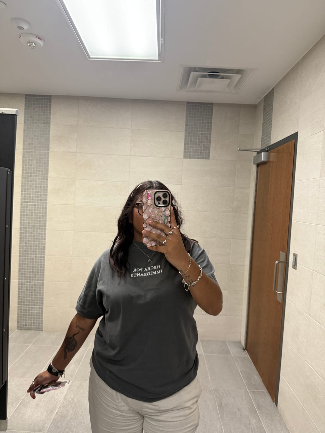 Customer photo review of 'Hecha Por Immigrants' Embroidered Grey Shirt