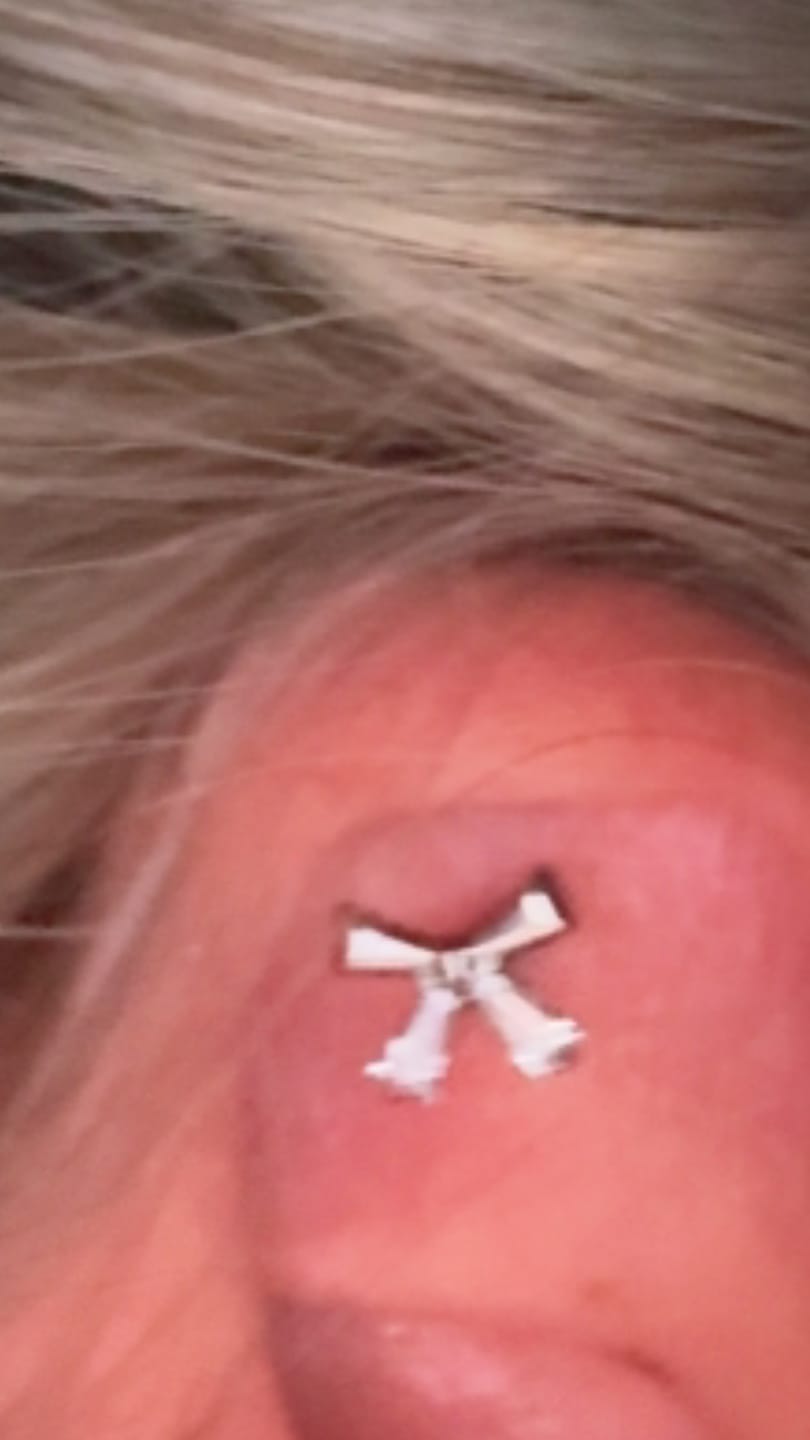 Customer photo review of Bow Tie Piercing | Titan