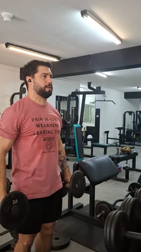 Customer photo review of Salty Savage Unisex "Pain Expels Weakness" Tee