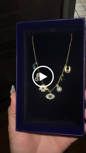 Customer video review of COLLAR GARGANTILLA SWAROVSKI SIMBOLICA LUNA INFINITO TREBOL OJO HERRADURA ORO