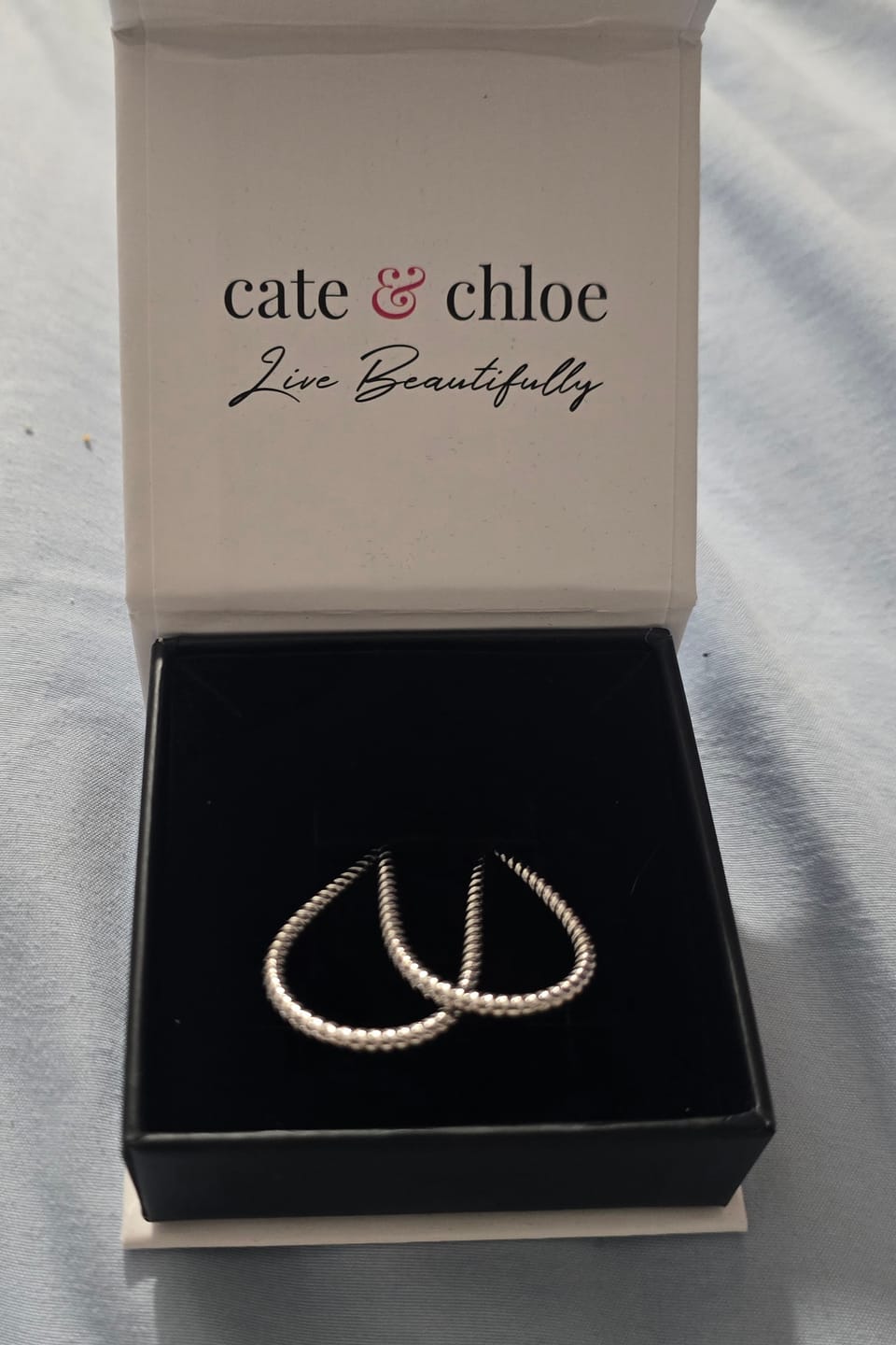 Customer photo review of Angelica 18k White Gold Plated 45mm Twisted U-Shaped Hoop Earrings