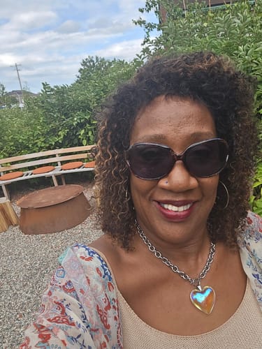 Customer photo review of CurlyMe Afro Curly Hair Pre-bleached Swiss HD Lace Front Wig Human Hair Pre plucked Wigs
