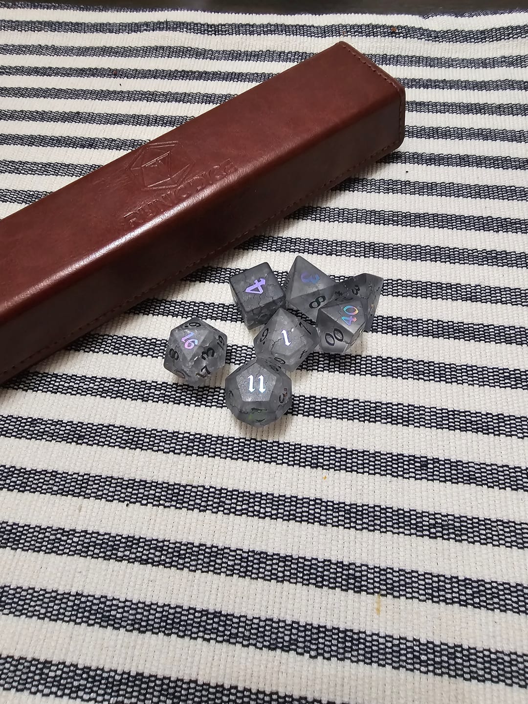 Customer photo review of Black Inked Lightning Cracked Glass DND Dice Set
