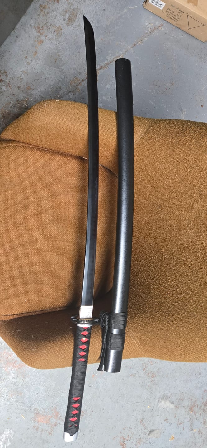 Customer photo review of The Tanjiro Handmade Katana T10 Steel Clay Tempered From Demon Slayer