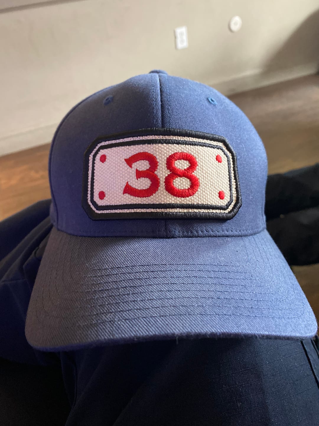 Customer photo review of FLEXFIT HOSE HAT WITH CUSTOM BACK OF HAT