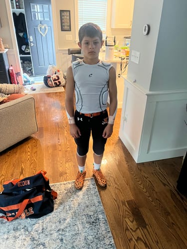Customer photo review of The Flintstones "Bedrock Blitz" Football Cleats - Quantum Speed by Phenom Elite