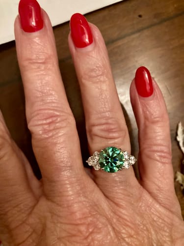 Customer photo review of Green Moissanite Side Stone Engagement Ring