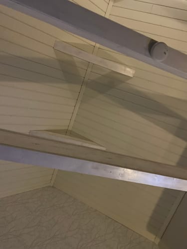 A customer's photo for ROLLZ THC gummies showing a view of a ceiling.