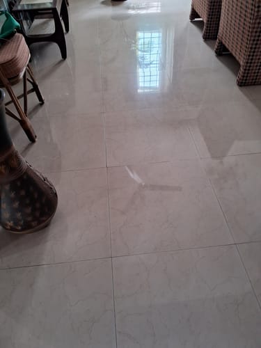 Customer's shiny tiled floor reflecting a window after using the Floor Surface Cleaner.