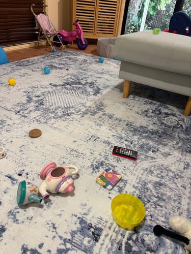 Customer's Mellow Mat with the Frosthaven print in a living room, covered with various children's toys.