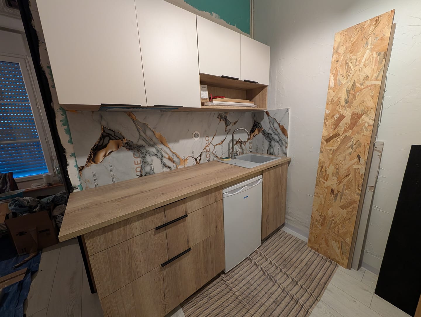 Customer photo review of Panneau Mural PVC Marbre Qatar – Veiné doré, Facile a Poser