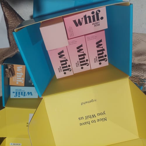 Customer's view inside a shipping box containing multiple pink boxes of the Musky Rose fragrance.