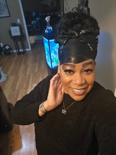 Reviewer smiling in a selfie, showing off her bright Pop On Smile veneers.