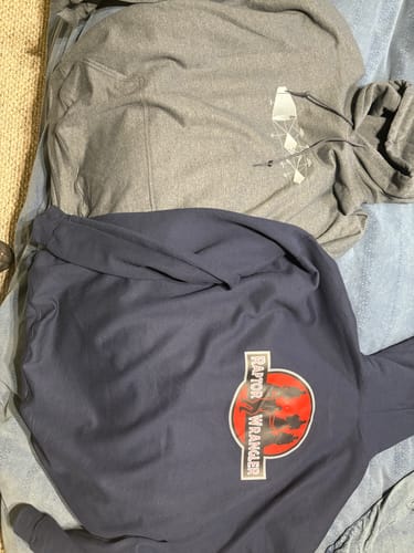 Customer's grey Mach Diamond unisex hoodie with a white graphic, laid flat next to another hoodie.