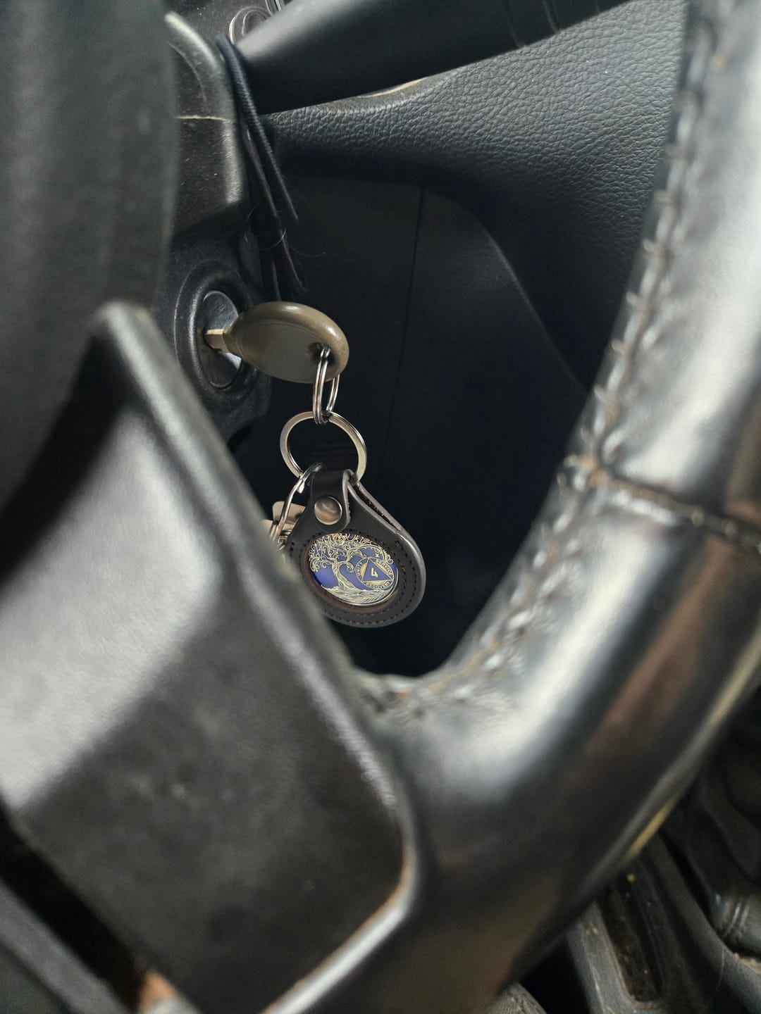 Customer photo review of Sobriety Mint Genuine Leather 40mm AA Medallion Keychain Holder - Recovery Chip/Coin/Token Holder - Black