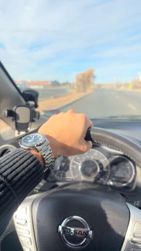 Customer wearing the sleek Lucky Fours® Valois watch on their wrist while driving.