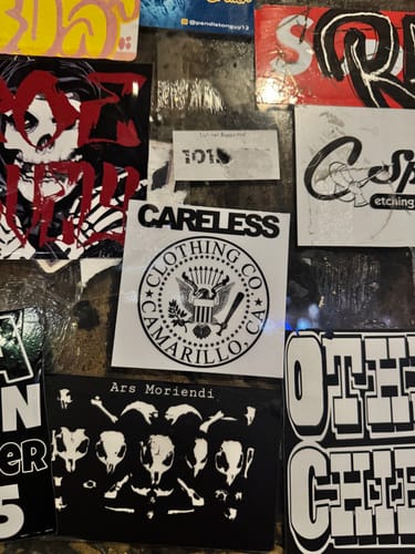 Customer's collection of custom stickers with various bold, skate-style designs.