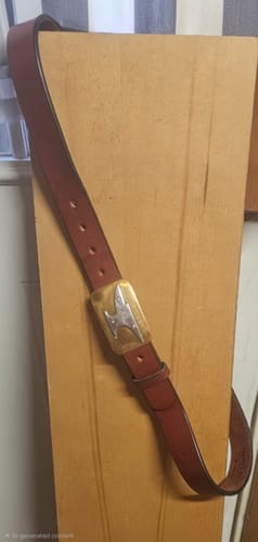 Reviewer's brown leather Gunner belt is shown with a custom buckle.