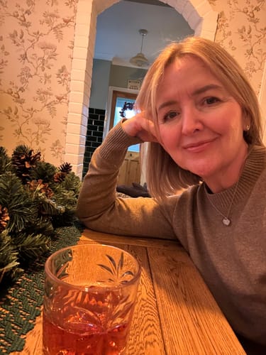 Reviewer smiling, showing the positive skin results mentioned in her product review.