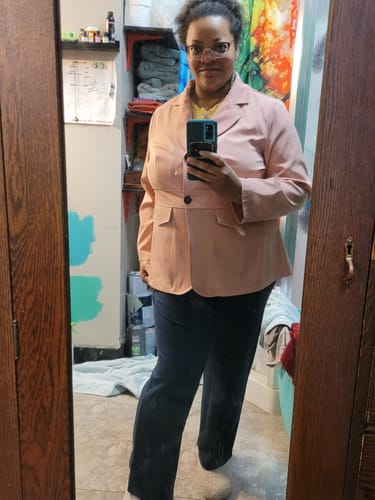 Customer showing the versatile Ellie Wide Leg Pants styled with a light pink blazer.