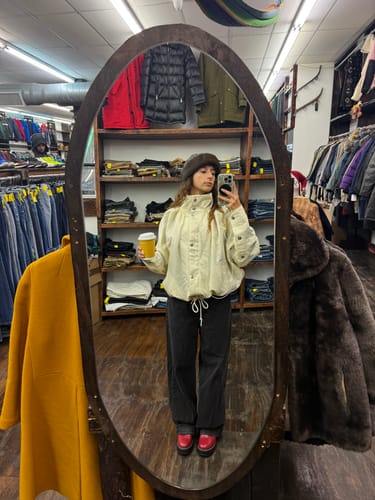 Reviewer in a mirror selfie, showing the oversized fit of the cream Stand Collar Button Up Jacket.