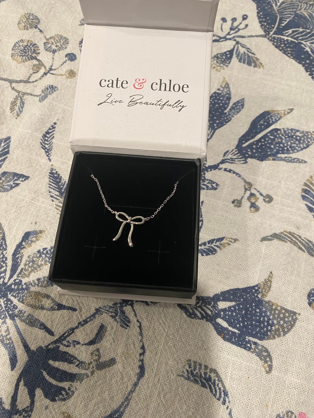 Customer photo review of Lola 18k White Gold Plated Ribbon/Bow Pendant Necklace