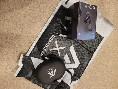 Customer's new XCOR PRO EXCHANGE retail box, black carrying case, and branded shipping mailer.