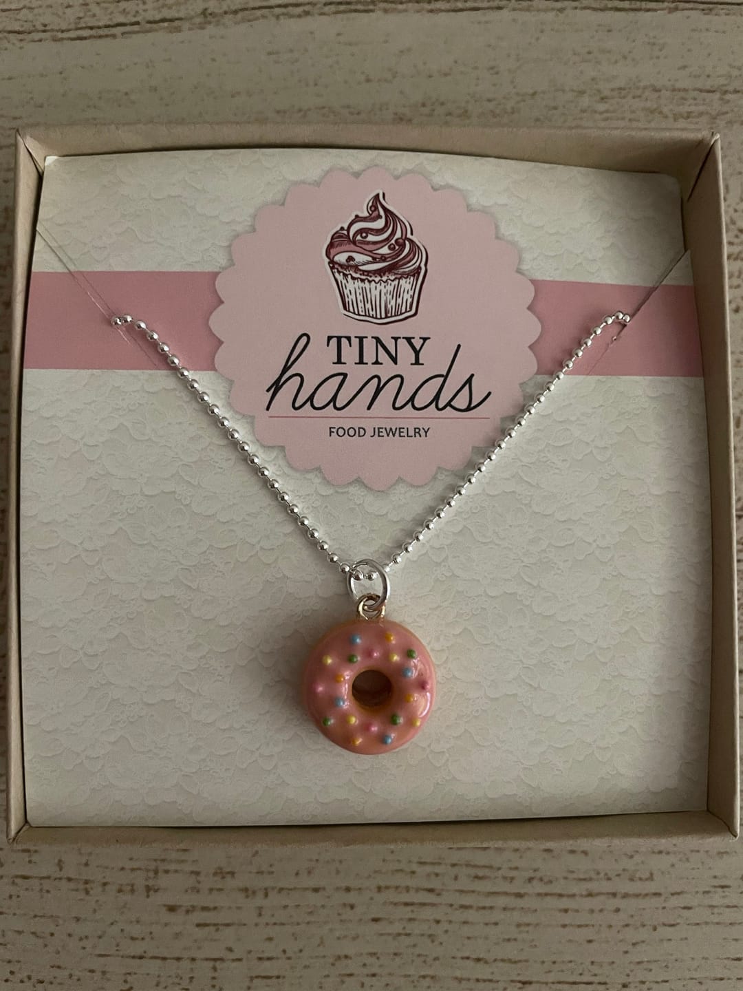 Customer photo review of Scented Strawberry Sprinkles Donut Necklace