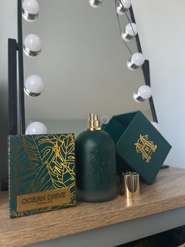Customer's Ocean Drive perfume bottle and elegant packaging displayed on a vanity.