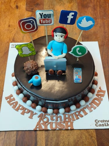 Customer's Social Media Lover Cake customized for a 15th birthday with a fondant figure and social media icons.