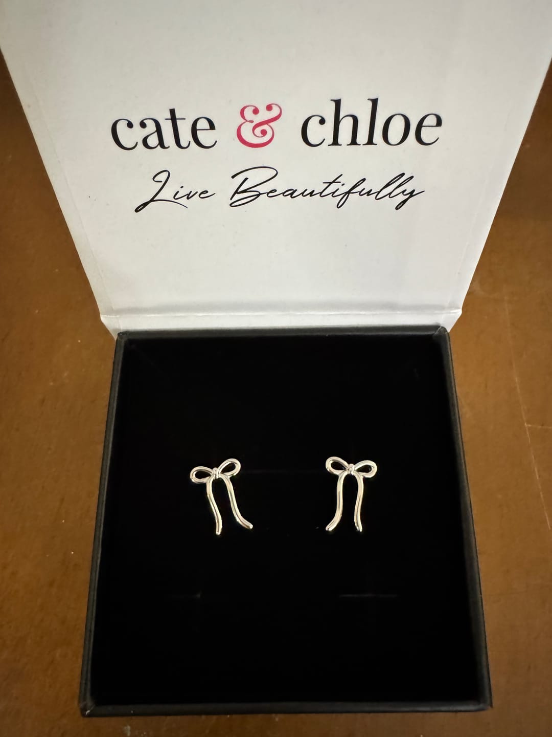 Customer photo review of Lola 18k White Gold Plated Ribbon/Bow Drop Earrings