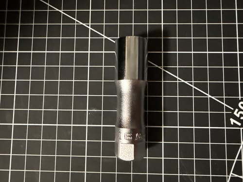 Customer's Ko-ken hex socket with a chrome finish, shown on a black gridded cutting mat.